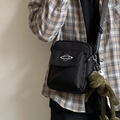 Black canvas crossbody bag with white planet embroidery and a green plush frog keychain - Black