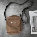 Brown canvas crossbody bag with planet print and adjustable black shoulder strap - Caramel color