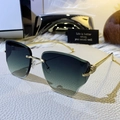 Frameless cat-eye sunglasses with teal gradient lenses and golden metal temples - Gradient Green