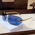 Frameless oversized square sunglasses with dark blue lenses and carved golden metal temples - Blue Gold