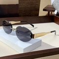 Modern rimless oval sunglasses with dark grey lenses and gold metal frame finish - Solid Grey