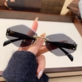 Modern rimless geometric sunglasses featuring dark grey lenses and gold metal bridge - Solid Grey