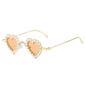 Modern heart-shaped sunglasses with crystal rhinestones and amber lenses in a 45-degree view - Gold Frame Champagne Lens