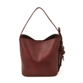 Retro burgundy leather bucket bag with adjustable shoulder strap and metal charm - Burgundy