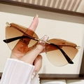 Frameless cat-eye sunglasses featuring brown gradient lenses and gold metal snake legs - Gradient Tea
