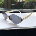 Frameless rhinestone cat-eye sunglasses with grey gradient lenses and gold hollow metal arms - Solid Grey