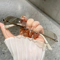 Stylish rimless oval sunglasses with gradient lenses and white temples for a chic look - Double Light Brown
