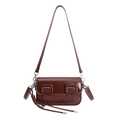 Detailed view of deep brown glossy PU leather shoulder bag with vintage buckles and knots - With Charm / Brown
