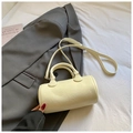 Creamy white cylinder barrel bag with textured faux leather and adjustable crossbody strap - Yellow Without Pendant
