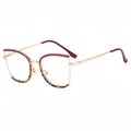 Elegante montatura per occhiali cat-eye in metallo dorato con accenti bordeaux e tartaruga - Montatura Rosso Demi