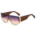 Oversized shield sunglasses with gradient lenses and tortoise shell temples on white background - Gold Frame Gray Pink Lens