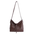 Brown soft leather crossbody bag with long strap and strap detail on white background - Brown