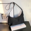 Minimalist black dumpling shoulder bag with leather patchwork corners for daily use - Black