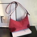 Red suede and patent leather dumpling bag with adjustable shoulder strap and metal zipper - Red