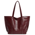 Deep red tote bag with silver rivets and polished faux leather finish for a retro look - Red