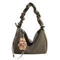 Pleated shoulder bag in olive green with a cute brown plush bear charm and drawstring detail - With Pendant / Green