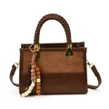 Brown patchwork handbag with suede finish, woven handle, and beaded charm accessory - Brown