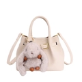 Cream bucket handbag with adjustable strap and cute plush bunny charm in soft lighting - No Pendant / White