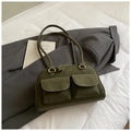 Close-up of olive green retro pillow bag with dual front pockets and bronze metal hardware - Green Without Pendant