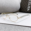 Occhiali da sole ovali in metallo dorato con strass a forma di cuore sulle aste - Montatura Oro Lente Trasparente