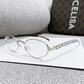 Oval silver metal sunglasses featuring heart-shaped crystal embellishments on the temples - Silver Frame Clear Lens