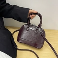 Deep reddish brown retro shell handbag with glossy oil wax leather texture and silver hardware - Coffee (No Pendant)