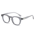 Retro oval sunglasses with translucent grey-black frames and silver metal temple accents - Gray Frame Clear Lens