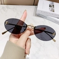 Frameless oval sunglasses with gold metal frame and crystal letter F on grey lenses - Solid Grey