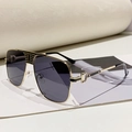 Fashionable pilot sunglasses featuring gold metal frame with black accents and C-logo - Gold Frame Black Grey