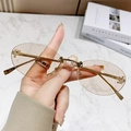 Fashionable rimless oval sunglasses with gold metal F logo and light brown lenses - Champagne
