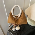 Brown suede-texture crossbody bag featuring white faux shearling handles and pom-pom charms - Brown