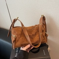 Caramel brown suede dumpling bag with gold hardware and adjustable strap in retro style - Brown