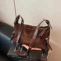 Vintage dark brown suede dumpling bag with adjustable leather strap and gold hardware - Coffee