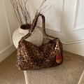 Retro leopard print tote bag with beaded tassel charm on a neutral textured floor - With Charm / Brown