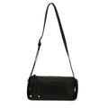 Detailed macro view of the black leather texture and gold zipper on a bolster bag - Black