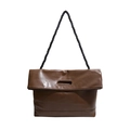 Minimalist brown leather tote bag with thick black braided shoulder strap and cutout handle - Brown