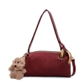 Burgundy textured shoulder bag with gold ring chain and plush puppy charm detail - With Pendant / Burgundy
