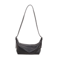 Black crescent moon shoulder bag with pleated texture and silver zipper detail - Black