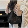 Detail of black large tote bag with decorative drawstrings and silver beads on texture - Black