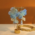 Elegant long floral tassel earrings with blue silk petals and pearls on a gold stand - E4786