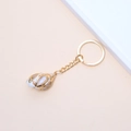 Detail showing natural sea shell in gold metal frame hanging on a golden keychain - 13# (Natural Spotted Shell)