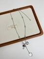 Detail of silver long chain necklace featuring double heart pendants and natural stone beads - Silver Transparent Double Heart