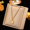 Detailed close-up of 18k gold evil eye pendant with intricate twisted rope texture - Round Evil Eye Style (CYN083A)