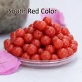 Close-up of polished red agate beads with center holes for DIY jewelry making - South Red / 8mm