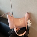 Pink glossy crinkled crescent bag with plush puppy charm and metal eyelet shoulder strap - Pink with Pendant