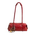 Chic red patent leather pillow bag with long shoulder straps and playful charms - Red