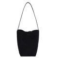 Minimalist black matte suede bucket bag with a slim shoulder strap on a white background - Black