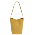 Minimalist mustard yellow suede bucket bag with adjustable shoulder strap and matte finish - Yellow