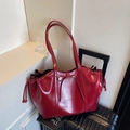 Large red glossy tote bag with bow detail and side drawstring for women's daily commute - Red