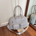 Silver PU leather multi-pocket tote bag with adjustable strap in a home setting - Gray